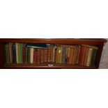 Shelf of assorted old small poetry books