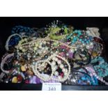 Crate of costume jewellery, necklaces, etc.