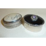 Two silver pill boxes, one with hardstone set into lid and marked as 900, the other with heart-
