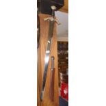Replica Celtic inscribed broadsword together with a replica short sword in scabbard