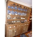 Large Victorian pine kitchen dresser having four shelves above four drawers with china knobs and two