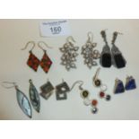 Seven pairs of silver earrings, inc. abalone, amber and marcasite, approx. 61g.