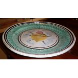 Large 19th century French tin-glazed charger with spongeware border and Sacred Heart motif to