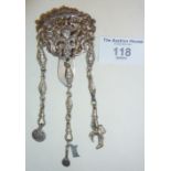 Sterling silver Chatelaine decorated with cherubs surrounding a heart, some charms attached.