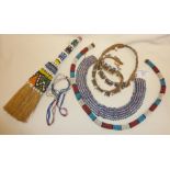 African Zulu beadwork items, including a tubular neckpiece, brush and ornaments