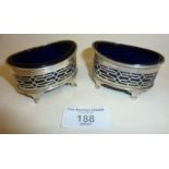 Pair of silver salts with blue glass liners. Hallmarked for Chester 1896 Haseler Brothers