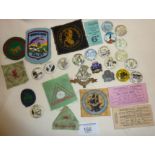 Collection of vintage Youth Hostel pin badges, military cap badge, etc.