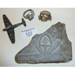 Possible WW2 German POW carved stone, an SS cap badge, etc.