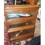 Globe Wernicke oak three-section bookcase with glass up and over doors