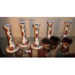 Five Victorian Glasgow Pottery floral painted candlesticks (J. & M.P. Bell Ltd) and three pieces