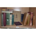 Shelf of assorted books, inc. 1941 "Active Service", pub. Australian War Memorial