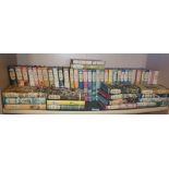 Shelf of Companion Book Club novels all with dust jackets