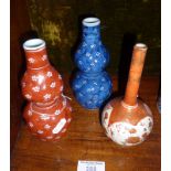 Satsuma bottle vase, 15cm, red marks to base. Together with two Chinese gourd vases, one blue and