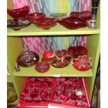 Three shelves of assorted glassware, inc. red glass Whitefriars ashtray and bowls