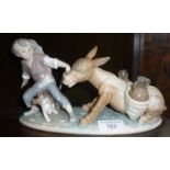 Lladro boy pulling a donkey figurine