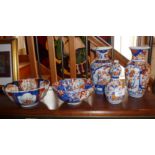 Imari gourd vase, 15cm high, together with two Imari vases, 19cm tall and two similar bowls (one A/