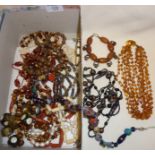 Box of costume jewellery inc. an amber necklace