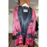 A Chinese red and black silk smoking jacket