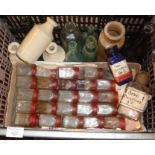 Crate of bottles and antique glass electric battery jars
