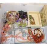 Box containing costume jewellery including coral necklace, amber necklace and a Murano glass foil
