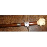 Victorian walking cane with carved "head in hand" ivory handle