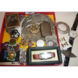 Box of old items, including a vesta, 825 hallmarked silver brooch, RAF cap badge etc