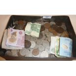 Old banknotes and coins in tin