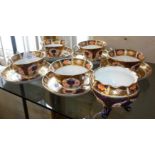 Royal Crown Derby cups and saucers and a similar three legged pot