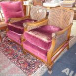 Pair of 1920's mahogany Bergere armchairs with cane back and sides and having carved arms and claw