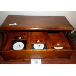 19th c. wooden triple inkwell stand with lift-up lid and sliding covers enclosing 3 porcelain