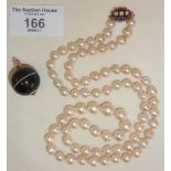 Genuine pearl necklace with diamond and ruby clasp, together with a bullseye agate ball pendant with