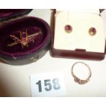 Gold bee brooch (tests as gold), set with red stones in an antique leather jewellery box. Together