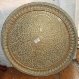 Persian brass wall plaque with floral relief decoration