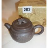 Chinese red ware teapot in protective case and silk cover