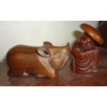 Carved Chinese wooden figure with hat and a carved wooden pig figure having secret compartment