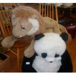 Large Hamleys soft reclining lion toy and an FAO Schwartz Panda