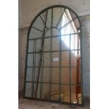 Arch topped wall mirror with metal 'window' facade