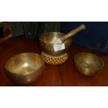 Three old Tibetan bronze singing bowls with beaded cushion and a clanger