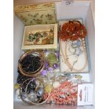 Box containing costume jewellery including coral necklace, amber necklace and a Murano glass foil