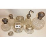 Various silver-topped vanity and scent jars and bottles