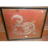 Chinese embroidery on pink silk of a dragon
