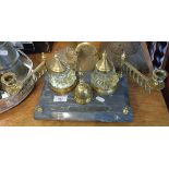 Brass and glass inkstand comprising pen rest, two candlesticks and a bell on a marble base