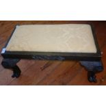 Carved oak footstool having carved cabriole legs and claw feet