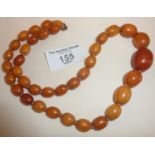 1920's Art Deco single row graduated amber bead necklace, approx 34g and 20" long