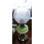 Victorian oil lamp having etched shade with moulded green glass reservoir on brass stem above