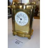 Brass carriage clock with circular floral painted enamel dial, 5" tall