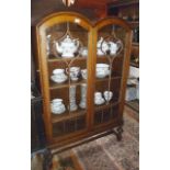 Double arched top two-door oak china cabinet