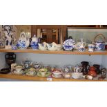 Large collection of assorted small china ornaments and cabinet cups (two shelves)