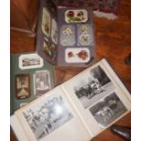 Two postcard albums and a photo album of horses