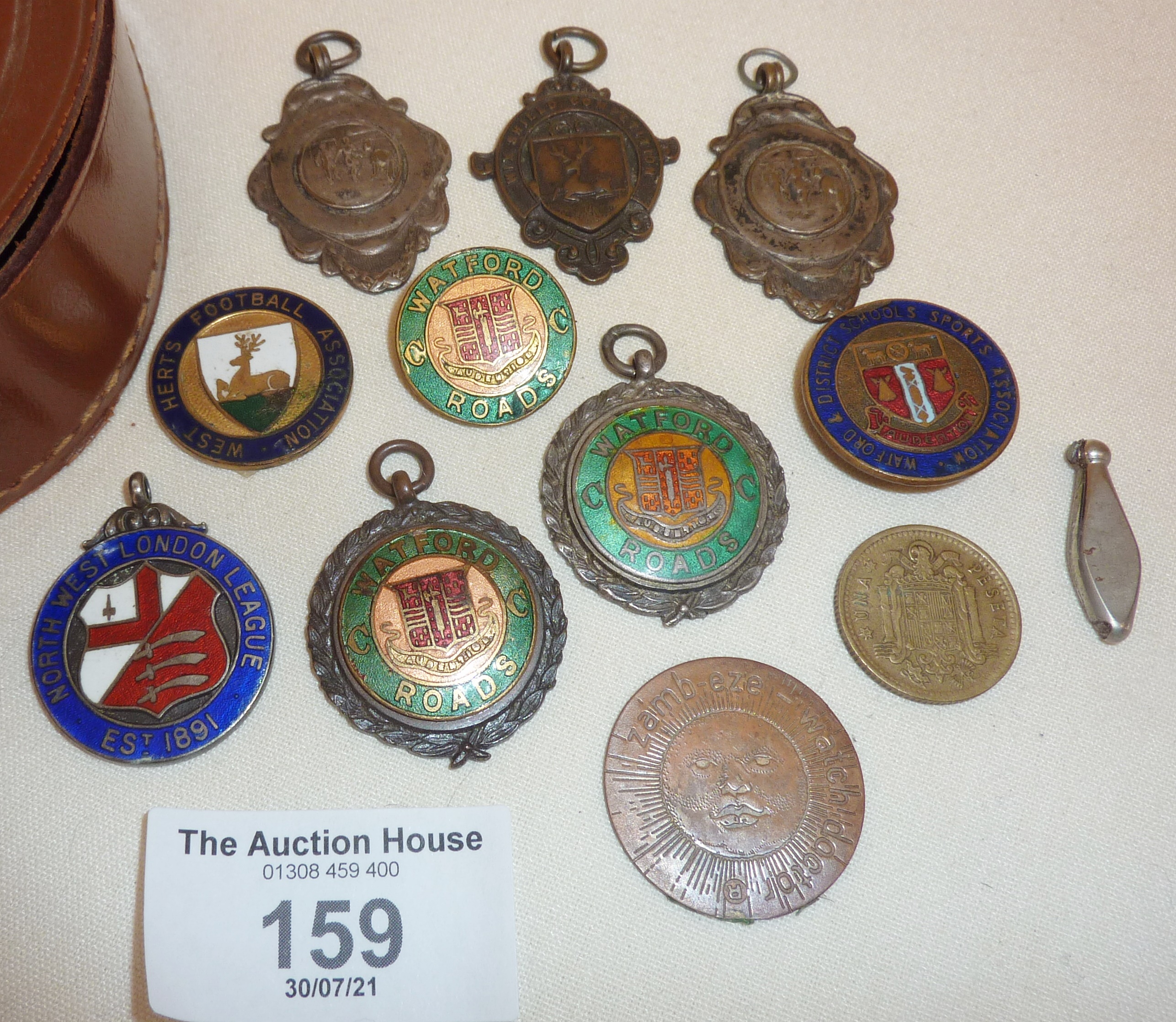 Various enamel sports medals and badges, some football and hallmarked silver